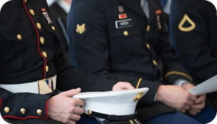 Three people sitting in their military uniforms