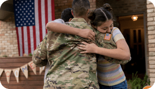 Service man hugging kids on front porch