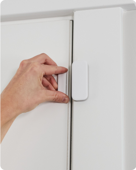 Person adjusting Door Sensor