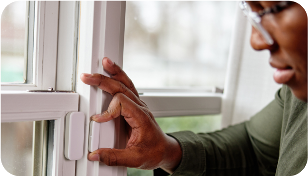 a person using Vivint window sensor