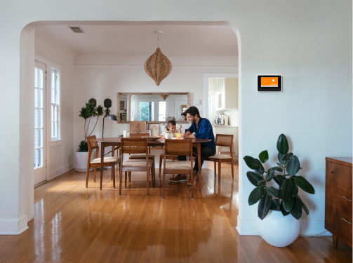 A Vivint Smart Hub mounted on a wall inside a cozy home