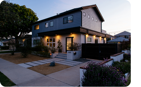 a house lit with warm light at night