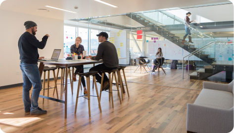 Vivint employees working in an open floorplan office