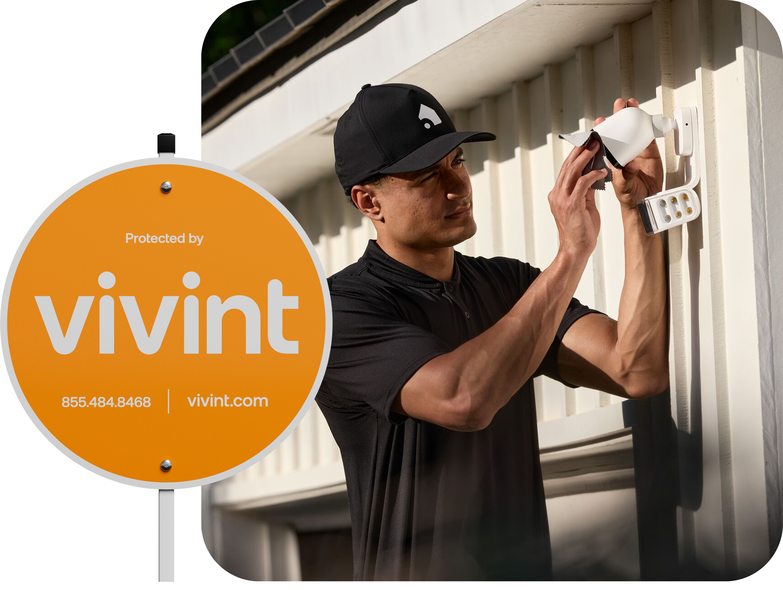 Vivint yardsign next to a rep installing a spotlight pro camera