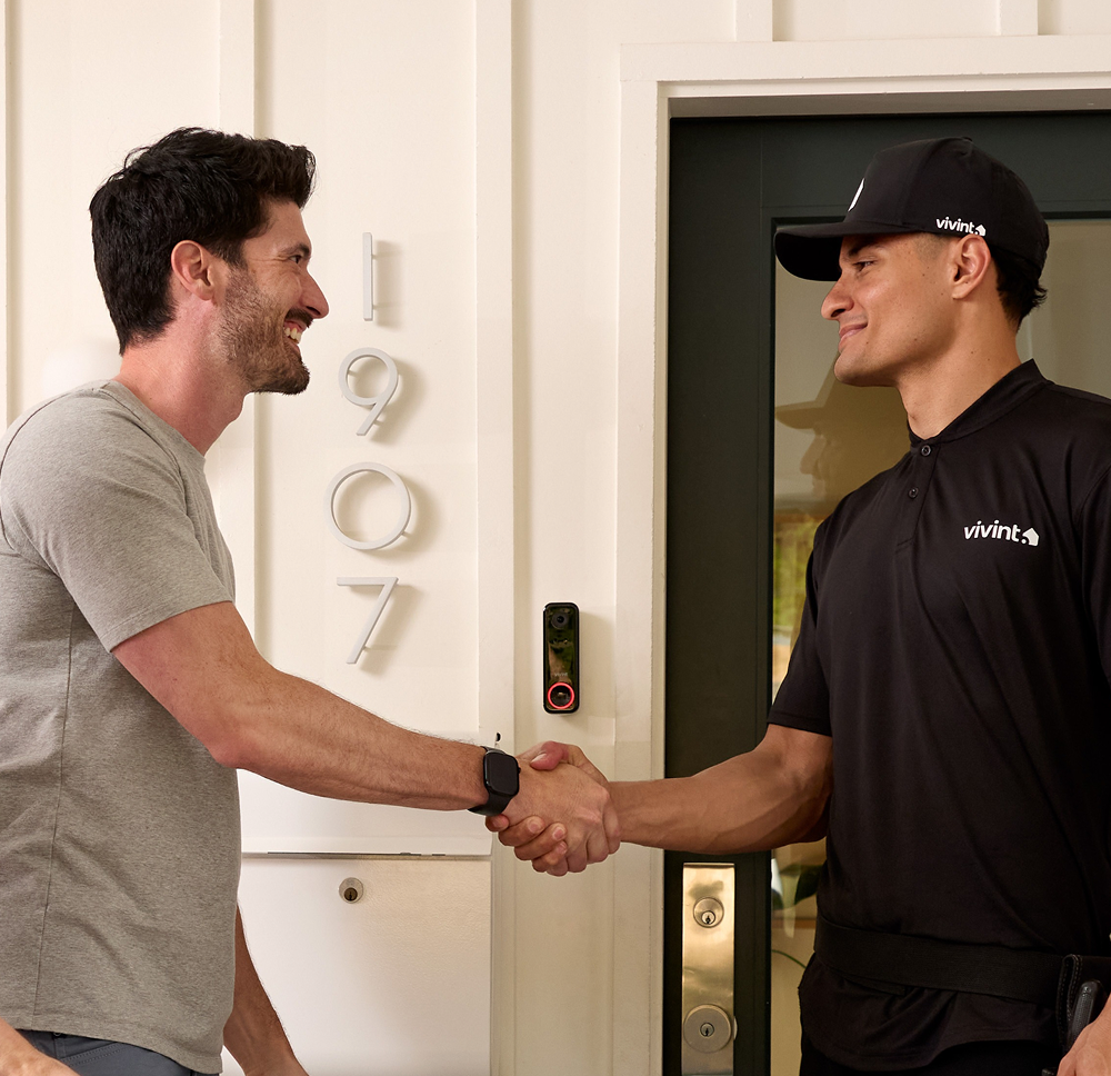 Vivint rep shaking hands with customer
