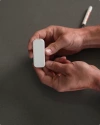 Hands holding Vivint door and window sensor