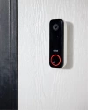 Vivint's Doorbell Camera Pro mounted beside a front door