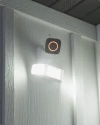 Vivint spotlight pro camera on the wall of a house