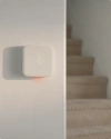 Vivint thermostat on the wall next to stairs