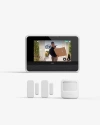 Vivint hub showing a person holding a package delivery, with Door & Window sensors and a motion sensor lined up underneath