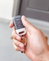 Person holds up their Vivint Key Fob