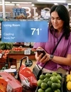 Woman checking home temperature on vivint app