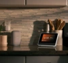 Smart Hub Pro 2 on a kitchen counter with an orange screen displayed