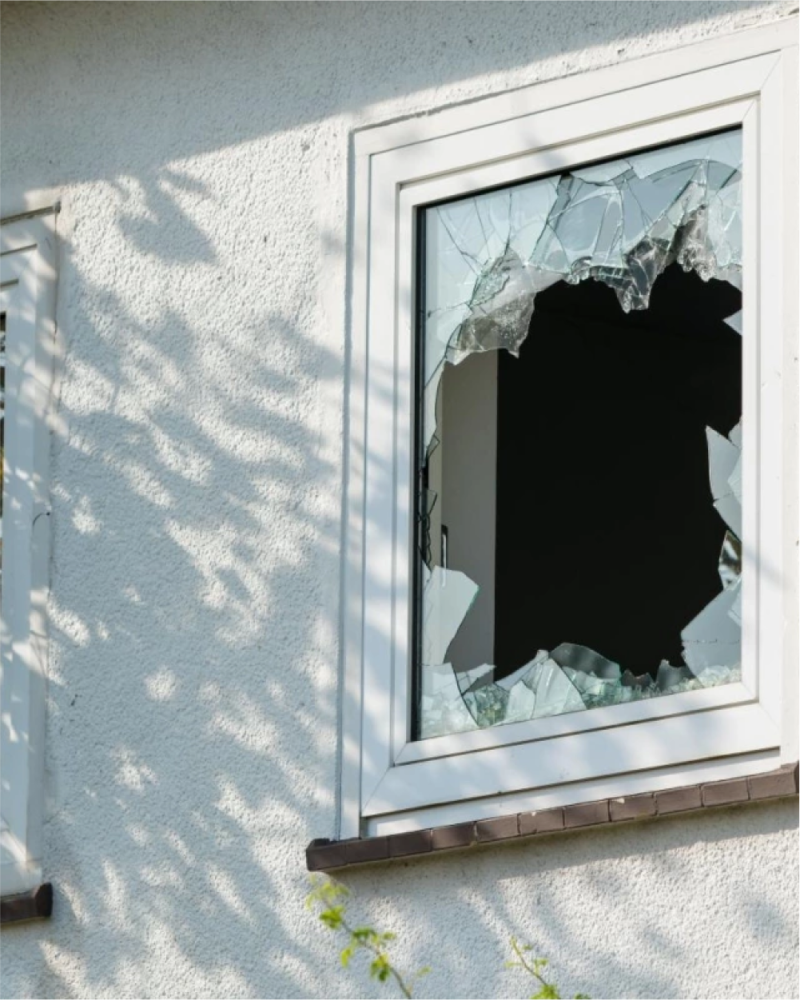 a broke in window looking from outside