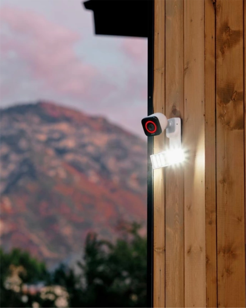 Spotlight Pro and Outdoor Camera Pro mounted on the exterior of a home