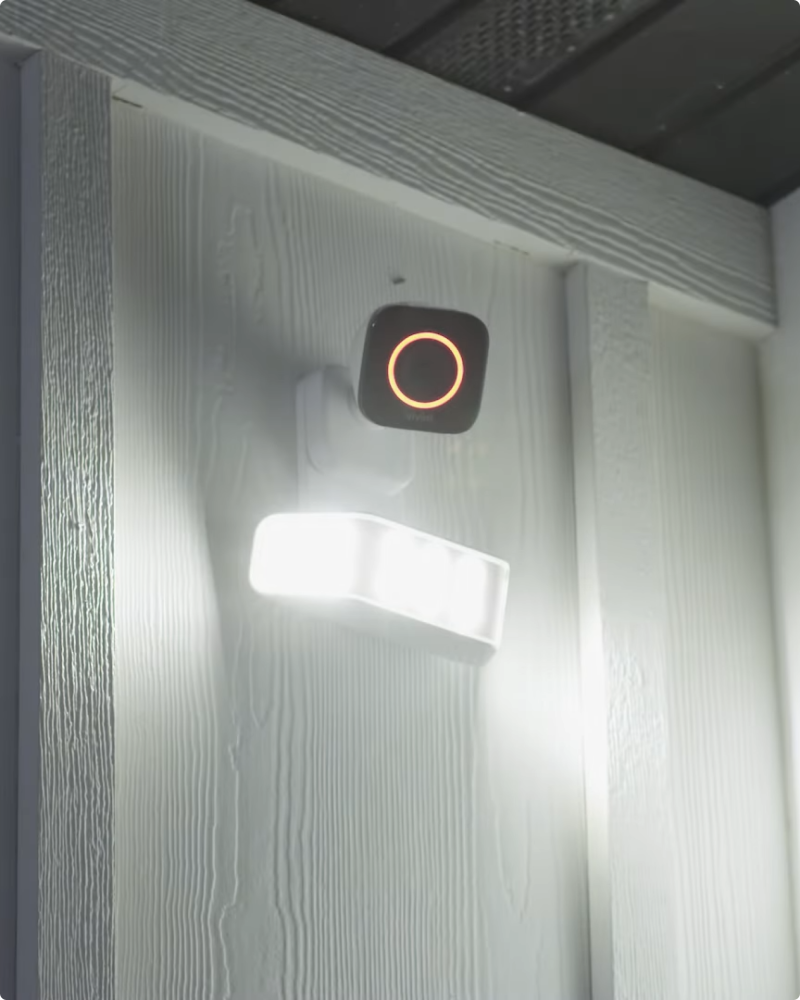 Vivint spotlight pro camera on the wall of a house