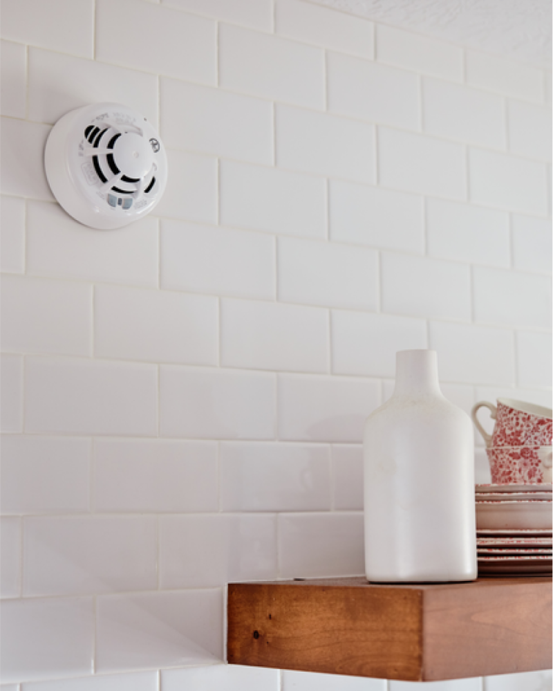 Smoke & CO Combo Detector mounted on a kitchen wall