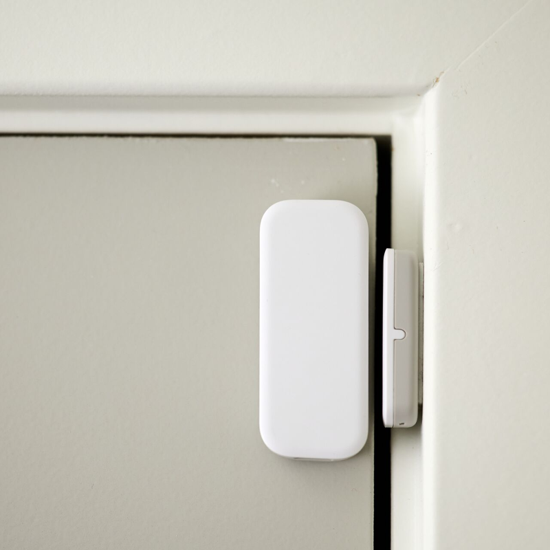 Vivint Window and Door Sensor mounted on a white door frame.