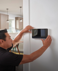 Smart Home Pro installing a Smart Hub on wall