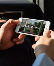Person holding up phone looking at Vivint Doorbell Camera Pro footage