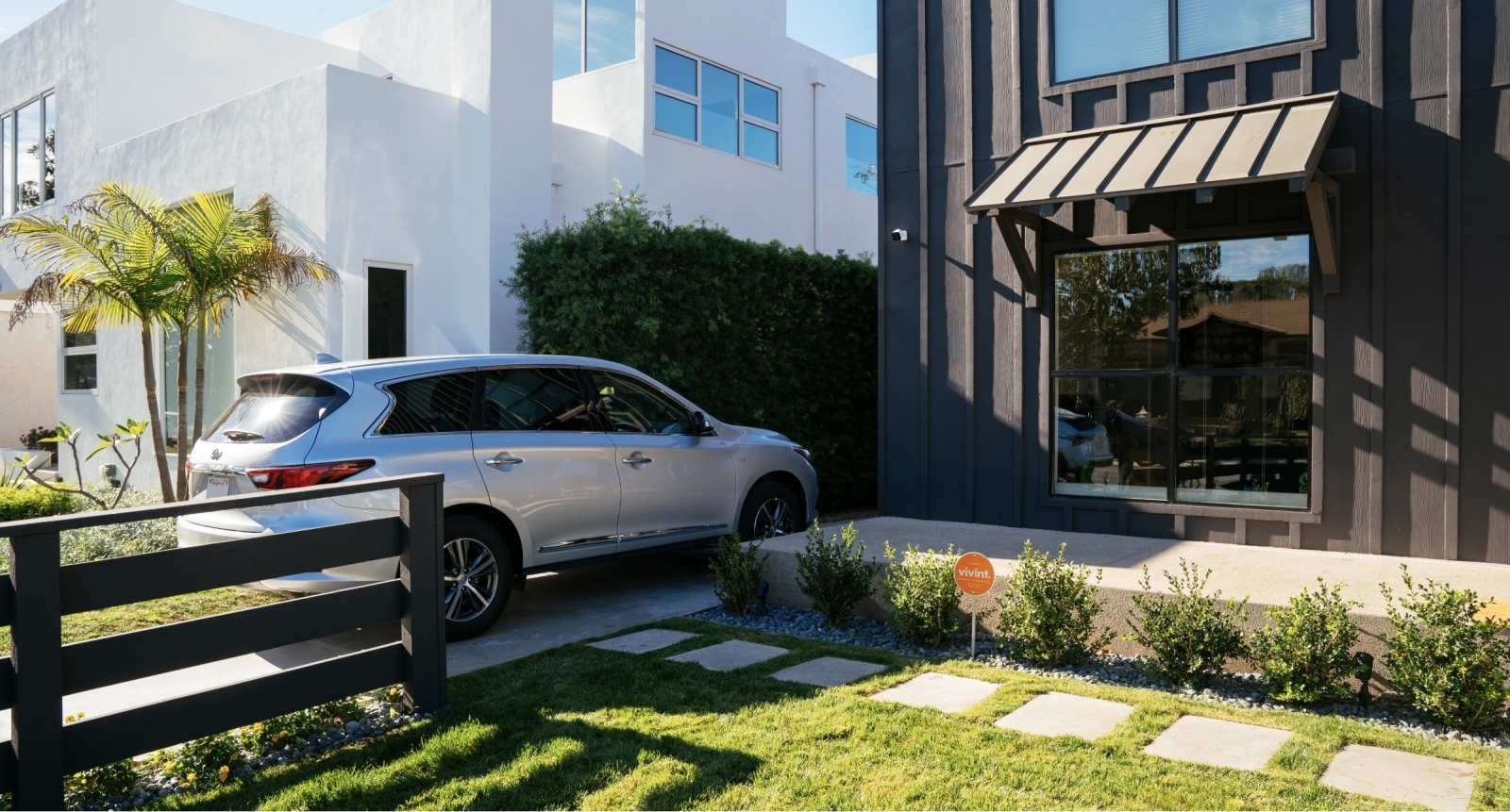 Car parked in front of a Vivint protected home