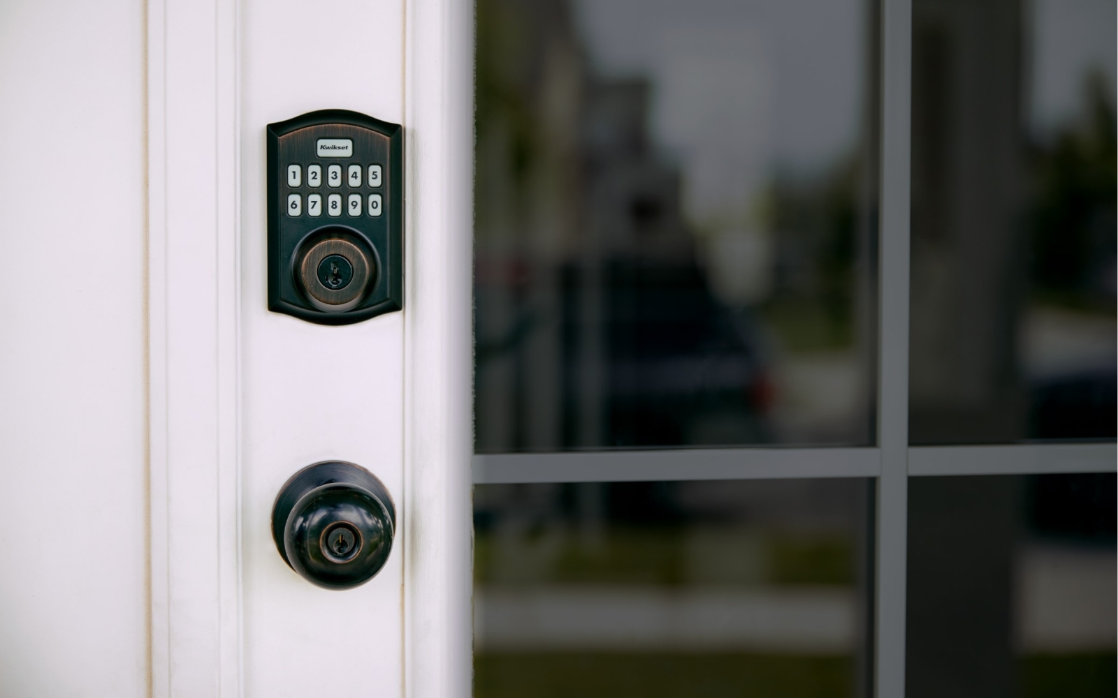 Vivint Smart Lock installed on white door