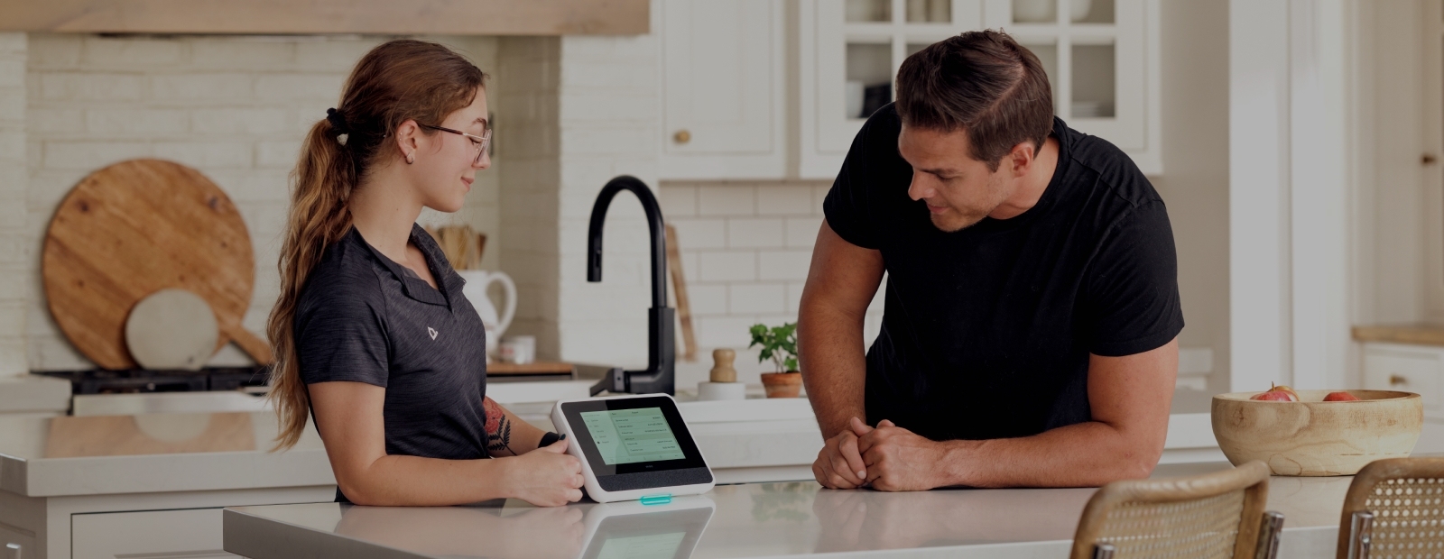 Hero image depicting a Vivint technician discussing with a potential client