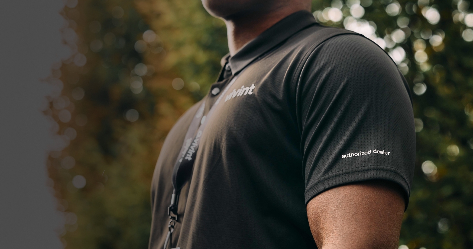 Smart Home Pro wearing their badge and an "authorized dealer" Vivint shirt
