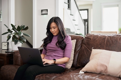 Woman researching home security on the internet.