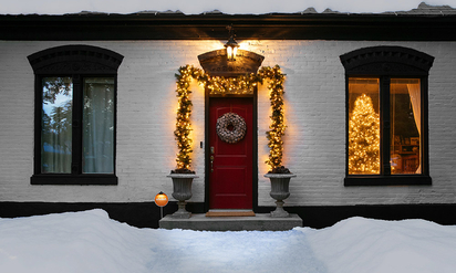 Exterior of a home decorated for Christmas and protected by Vivint.