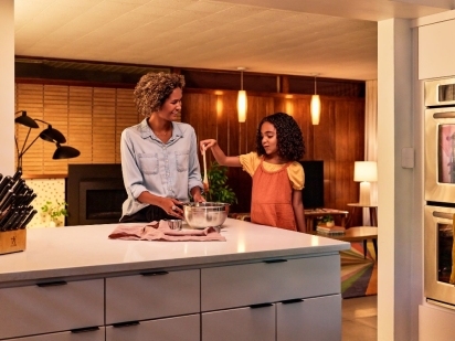 Mother and daughter making dinner.