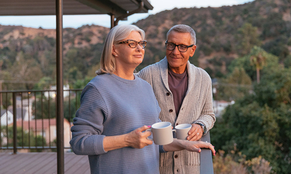 Elderly couple on their porch.