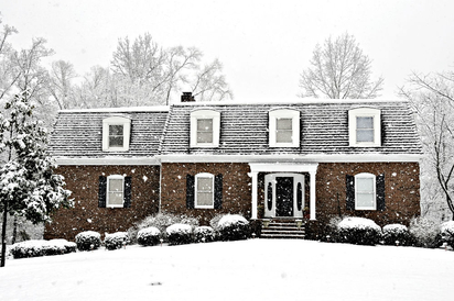 A home's exterior on a snowy day.