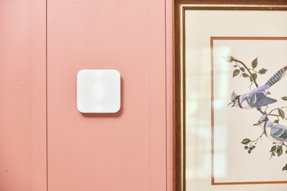 Vivint professional installing a camera.
