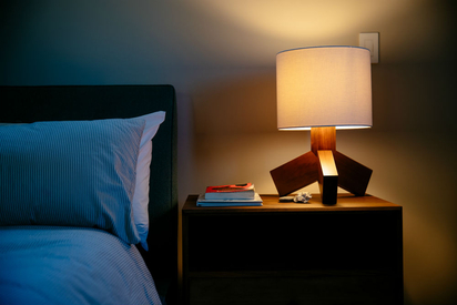 A lamp on a bedside table.