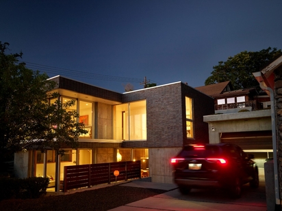 A home's exterior lit up at night.