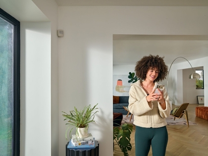 Woman in a home that is protected by Vivint.
