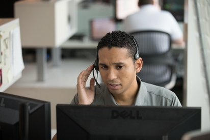 Vivint monitoring professional taking a call.