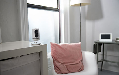 Vivint Indoor Camera Pro inside a home's living room.