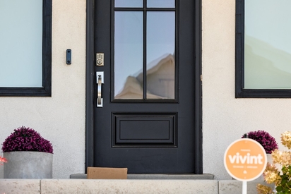 Home's exterior with a Vivint yard sign.