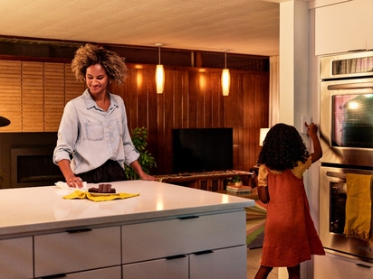 Mother and daughter in the kitchen.
