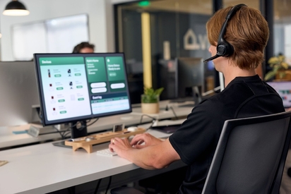 Vivint monitoring professional taking a call.