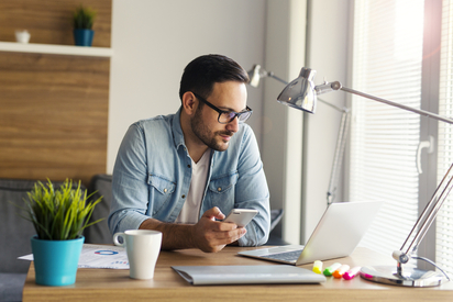 Woman working from home at a laptop.
