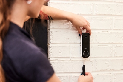 Vivint tech installing a Doorbell Camera Pro.