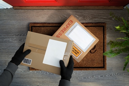 Packages being nabbed from a front porch.