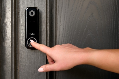 Woman ringing the Doorbell Camera Pro