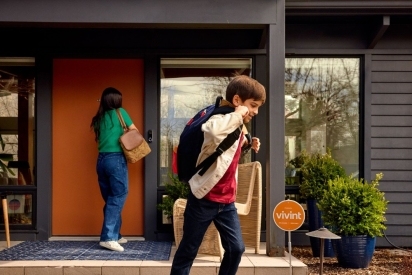 Family leaving the house for school dropoff.