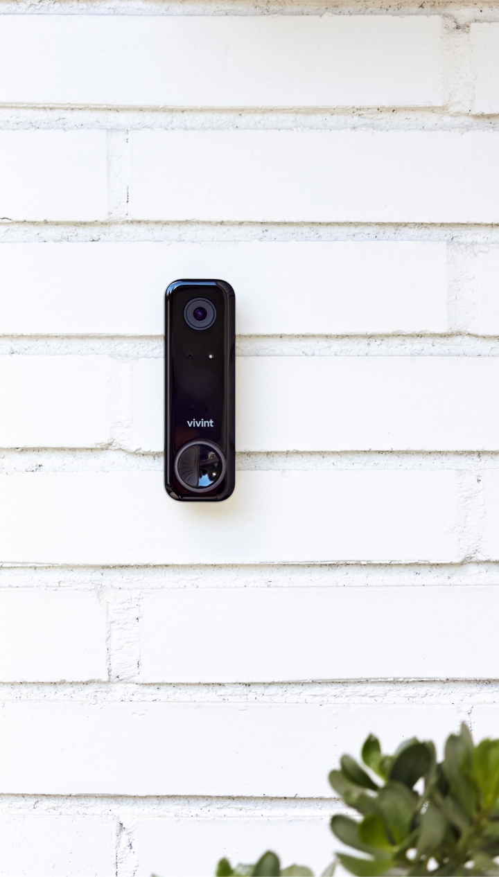 Vivint doorbell camera on white panels