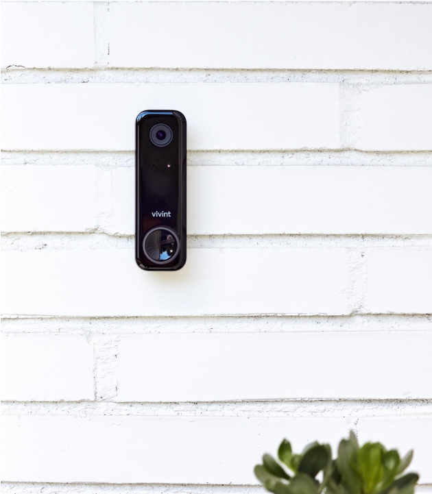 Vivint doorbell camera on white panels