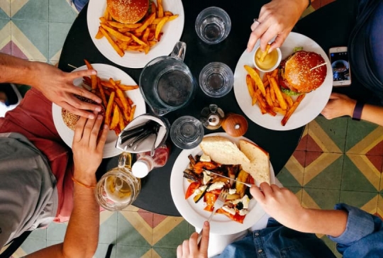 Aerial view of a restaurant table with plates of food